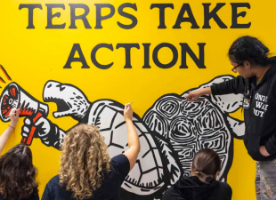 students paint mural